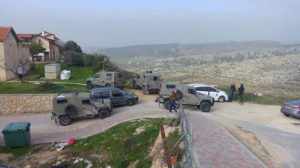 Security forces outside West Bank settlement of Otniel, January 18 2016