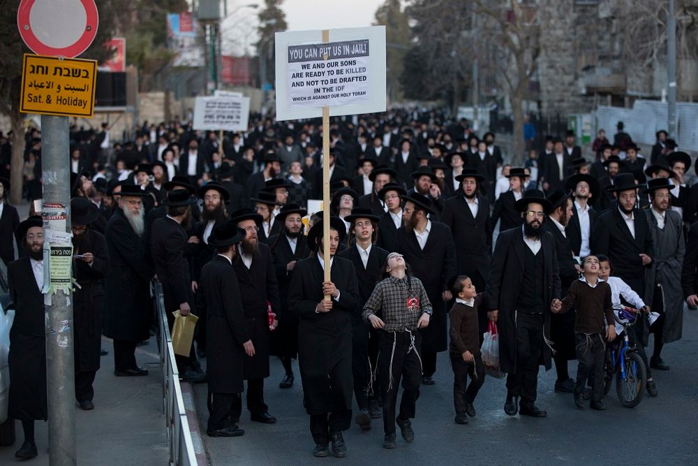 Ultra-Orthodox Jews take part in a protest against Israeli army conscription in Jerusalem, Tuesday, March 28, 2017. Ultra-Orthodox leaders say they serve the Jewish nation through religious study and prayer and fear integration in the army threatens their