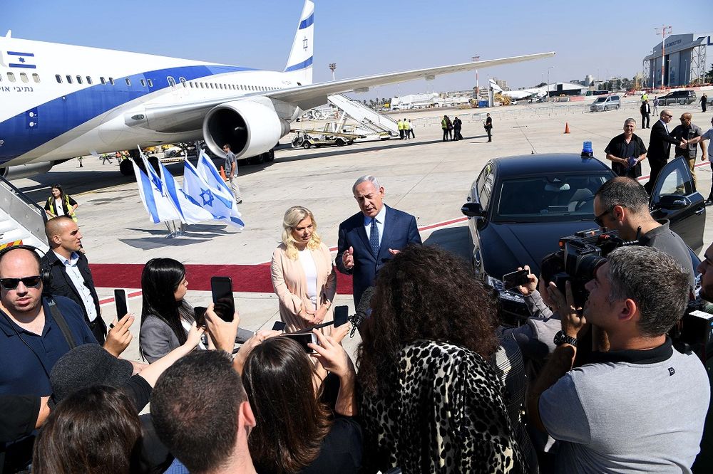 Israel's Prime Minister Benjamin Netanyahu with his wife Sara at Ben Gurion International Airport.