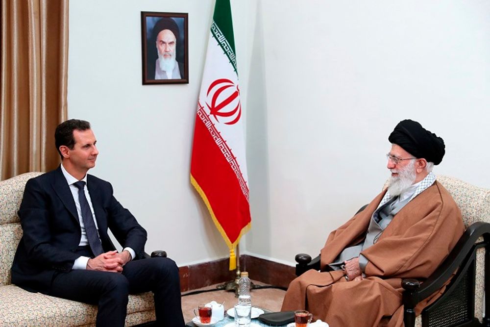 In this photo released by an official website of the office of the Iranian supreme leader, Supreme Leader Ayatollah Ali Khamenei, right, speaks with Syrian President Bashar Assad during their meeting in Tehran, Iran, Monday, Feb. 25, 2019.