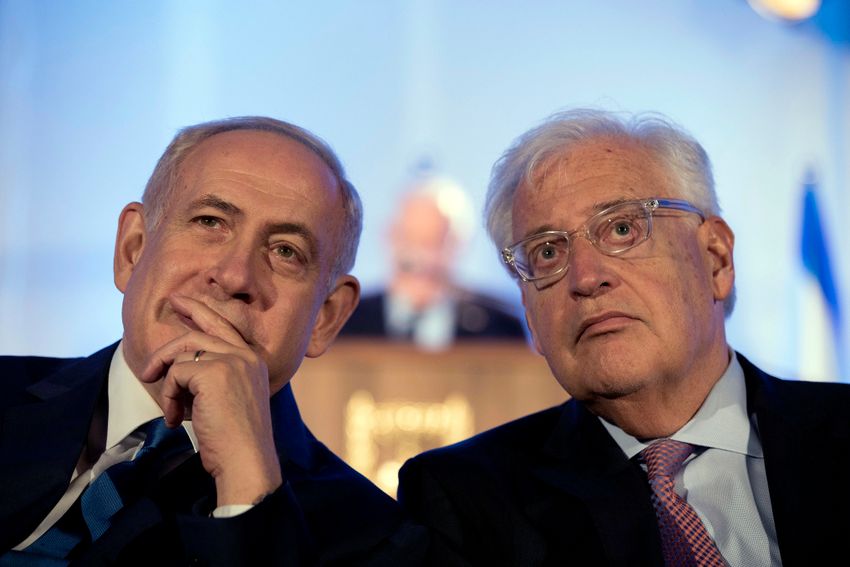 FILE- Israeli Prime Minister Benjamin Netanyahu and David Friedman, the United States Ambassador to Israel attend a ceremony celebrating the 50th anniversary of the unification of Jerusalem on May 21, 2017.