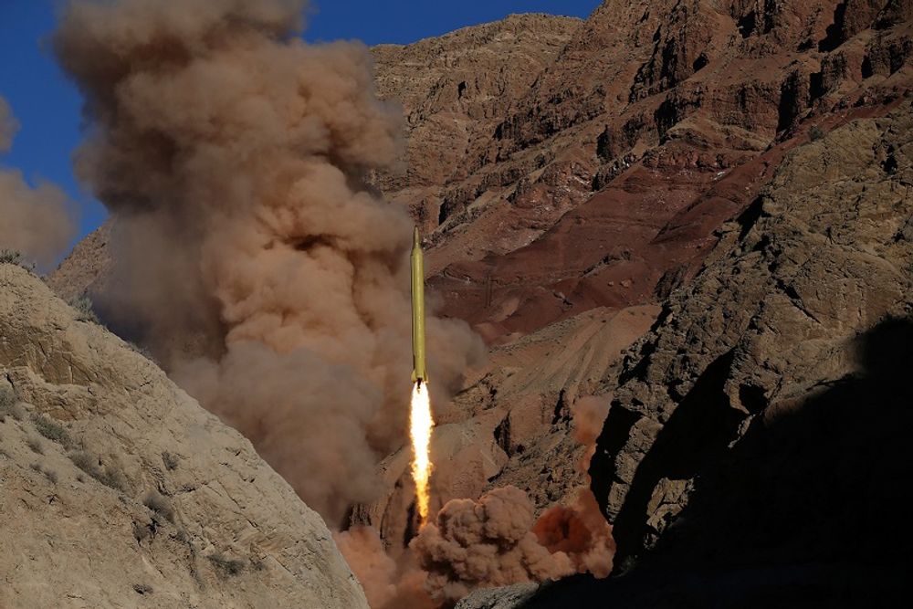 FILE: In this photo obtained from the Iranian Fars News Agency, a Qadr H long-range ballistic surface-to-surface missile is fired by Iran's powerful Revolutionary Guard, during a maneuver, in an undisclosed location in Iran, Wednesday, March 9, 2016. Iran