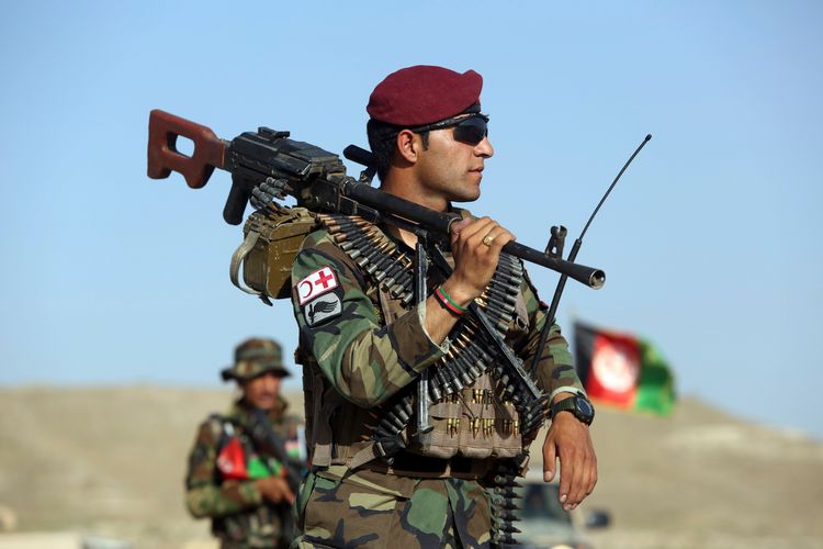 Afghan National Army soldiers stand guard at a checkpoint on the outskirts of Kabul, Afghanistan, Monday, Aug. 21, 2017. Deep in the mountains of eastern Afghanistan, on the front lines against Taliban and Islamic State fighters, U.S. military commanders