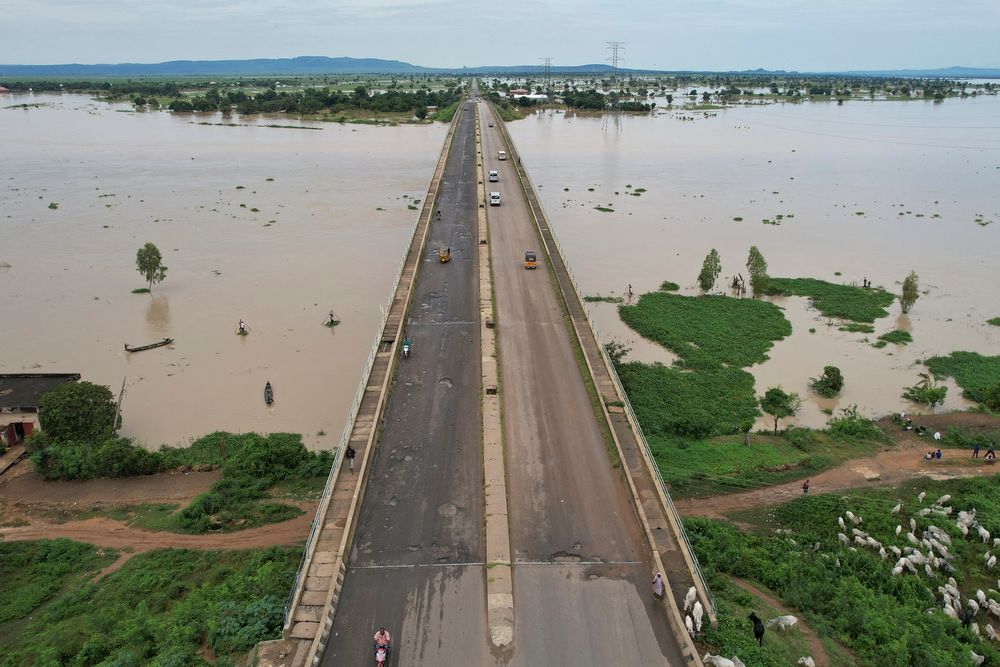 Residents fleeing rising waters in Adamawa State, northeastern Nigeria, on September 25, 2022.