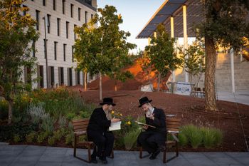 Ultra-Orthodox Jewish men from the Vizhnitz Hasidic dynasty study Torah outside the Justice Ministry in Jerusalem