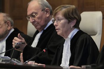 Presiding judge Joan Donoghue, right, opens the session at the International Court of Justice, or World Court, in The Hague, Netherlands.