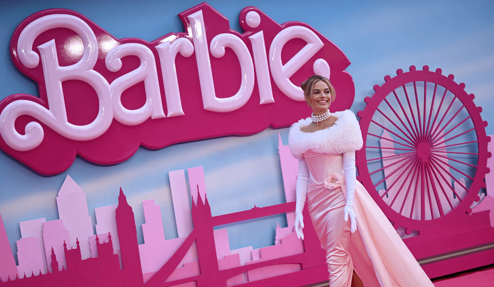 Actress Margot Robbie poses on the pink carpet as she arrives for the European premiere of "Barbie" in central London, United Kingdom.