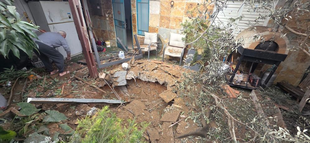 The scene of an interception fragment impact in the courtyard of a house in Rishon LeZion