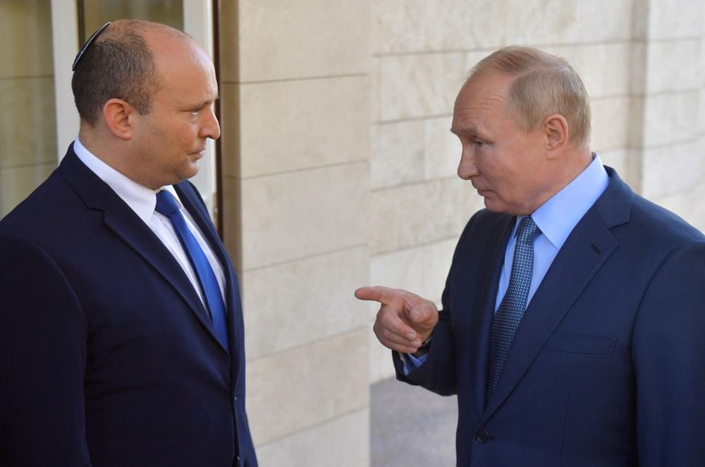 Russia's President Vladimir Putin (R) speaks with Israel's Prime Minister Naftali Bennett in Sochi, Russia, on October 22, 2021.
