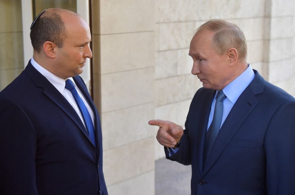 Russia's President Vladimir Putin (R) speaks with Israel's then-prime minister Naftali Bennett in Sochi, Russia.