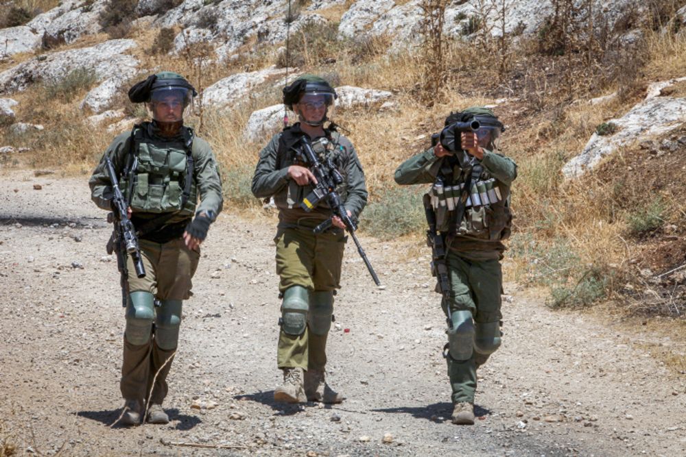 Israeli soldiers in the Palestinian village of Beit Dajan, near the West Bank city of Nablus, on July 8, 2022.