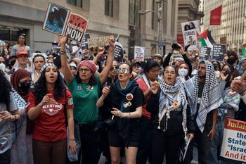 Protesters shout slogans during a Pro-Palestinian demonstration calling for economic blockade and demanding a cease-fire on the Israel Palestinian conflict outside The New York Stock Exchange on Monday, April 15, 2024, in New York.
