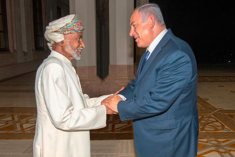FILE - Oman's Sultan Qaboos, left, greets Israeli Prime Minister Benjamin Netanyahu in Muscat, Oman, on Oct. 26, 2018.