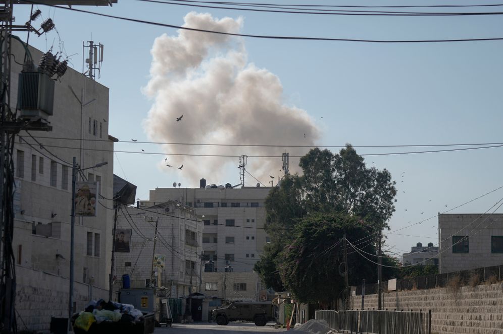 Smoke rises after an explosion during an Israeli military operation in the West Bank Jenin refugee camp