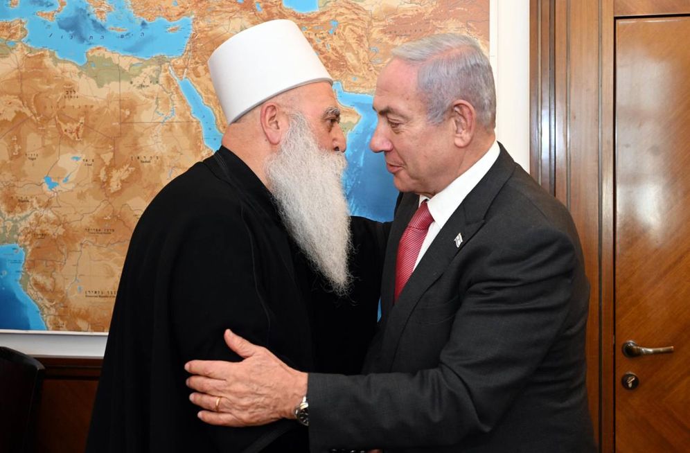 Israel's Prime Minister Benjamin Netanyahu (R) with the spiritual leader of the Druze community in Israel, Sheikh Mowafak Tarif.