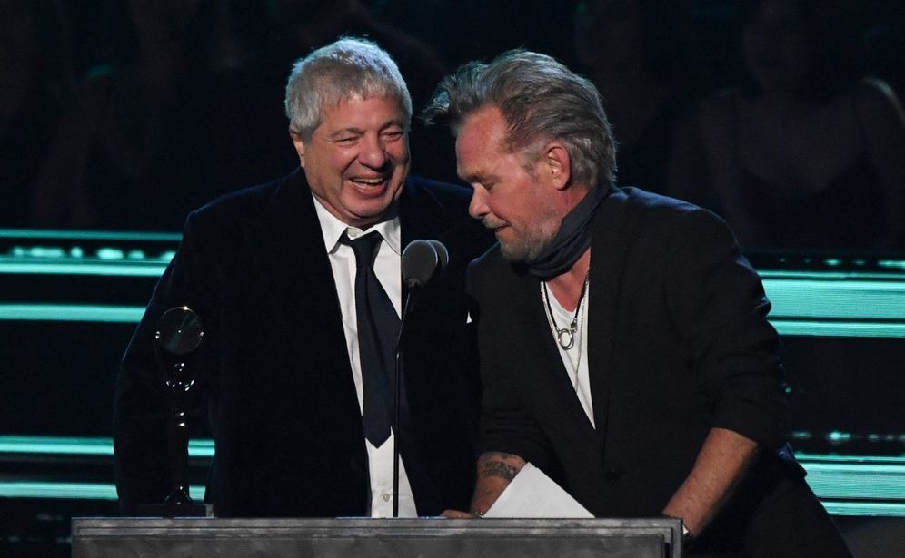 U.S. singer-songwriter John Mellencamp (R) gives the Ahmet Ertegun Award to lawyer Allen Grubman during the 37th Annual Rock and Roll Hall of Fame Induction Ceremony at the Microsoft Theater on November 5, 2022, in Los Angeles, California, United States.