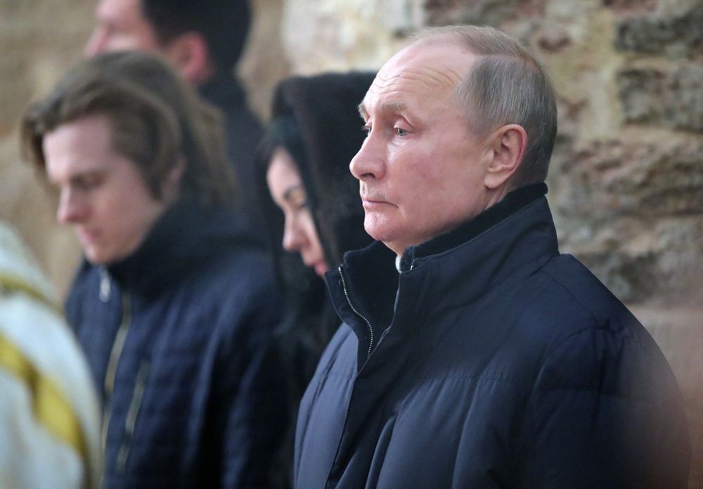 Russia's President Vladimir Putin attends the Orthodox Christmas mass at Saint Nikolai Church on Lipno Island outside Veliky Novgorod, Russia, on January 7, 2021.