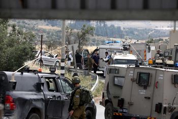 Israeli security forces at the scene of what the IDF said was a deliberate car ramming attack near Hebron Hills in the West Bank, on May 14, 2020