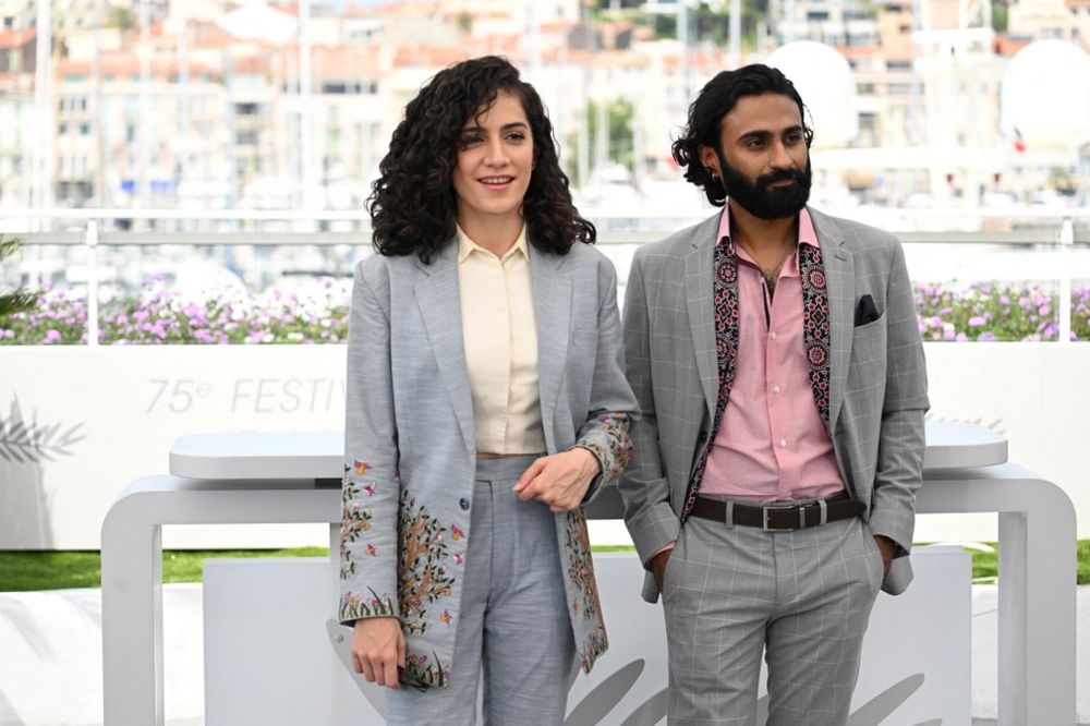 Actress Rasti Farooq (L) and actor Ali Junejo attend a photocall for the film "Joyland" at the 75th Cannes Film Festival, France, on May 22, 2022.