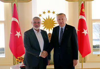 FILE - Turkey's President Recep Tayyip Erdogan, right, shakes hands with Hamas movement chief Ismail Haniyeh, prior to their meeting in Istanbul, on February 1, 2020.