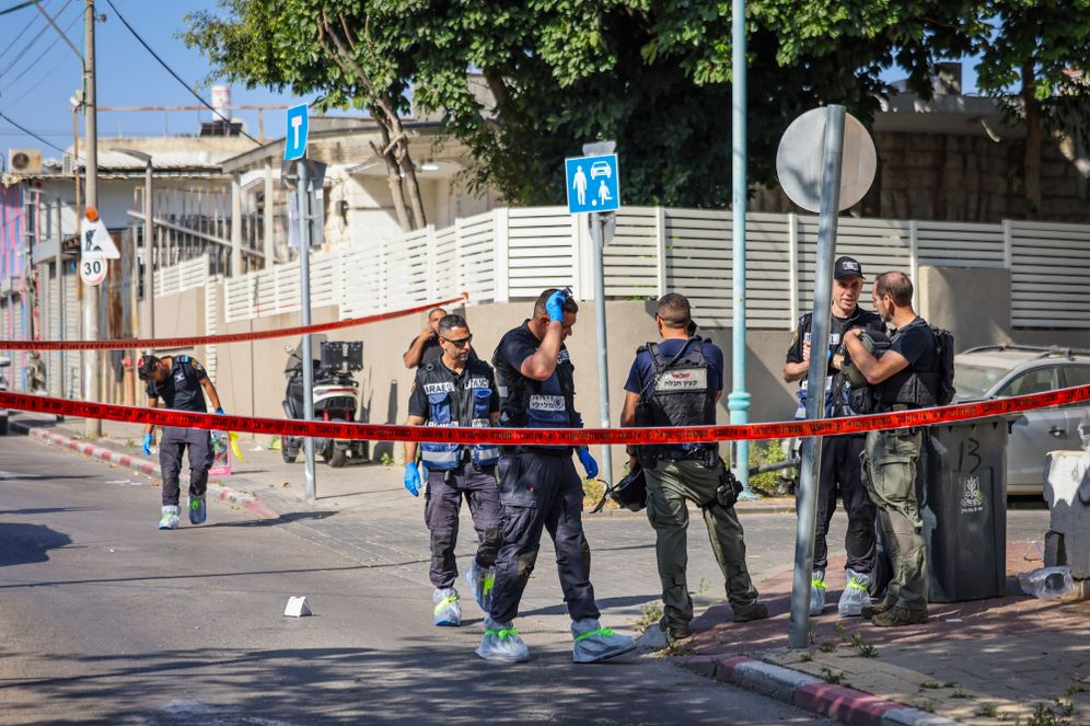 Israeli police forces investigate the scene of a shooting incident in Ramla, central Israel, May 11, 2026. One woman was killed and several others were injured. 
