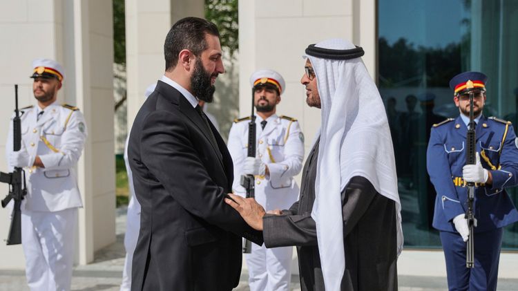 Photo released by the official Syrian news agency SANA shows United Arab Emirates President Sheikh Mohammed bin Zayed Al Nahyan (right) welcoming Syrian President Ahmad al-Sharaa in Abu Dhabi, United Arab Emirates


