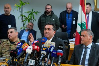Lebanese caretaker Minister of Public Works and Transportation Ali Hamieh, center, speaks during a press conference at the Rafik Hariri International Airport in Beirut, Lebanon