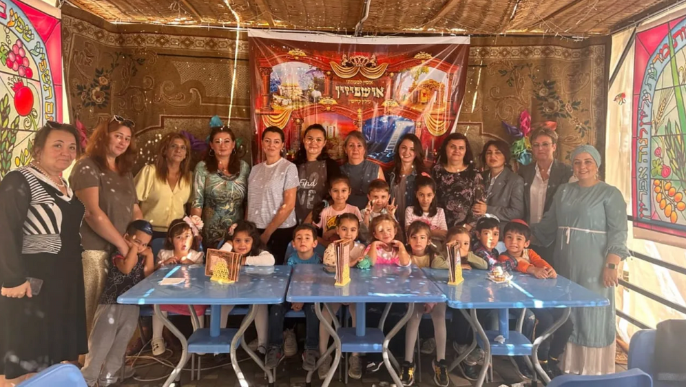 (photo credit: Baku Jewish community) Students enrolled in the Jewish program at Baku’s School No. 46 celebrate the festival of sukkot.
