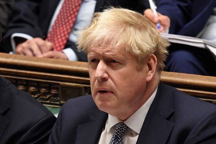 Britain's Prime Minister Boris Johnson reacting in the House of Commons in London, United Kingdom, on January 12, 2022.
