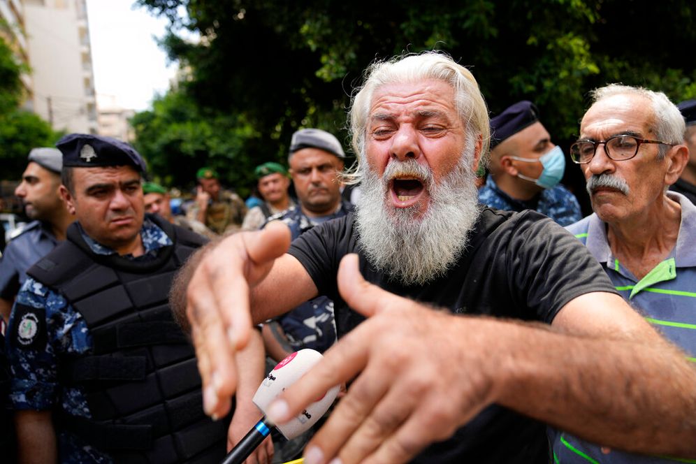 A man shouts as he protests against banks outside a bank where another armed man holds hostages in Beirut, Lebanon, on August 11, 2022.