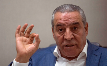 Le nouveau secrétaire général du Comité exécutif de l'OLP, Hussein al-Sheikh, accorde une interview à l'Associated Press dans son bureau de Ramallah, le 13 juin 2022.