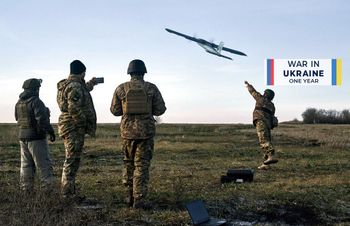 Caption: Ukrainian soldiers launch a drone at Russian positions near Bakhmut, Donetsk region, Ukraine