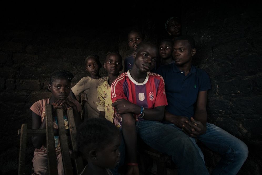 ALEXIS HUGUET / AFP A family of Central African refugees in Inke camp, northern Democratic Republic of Congo, waits to go to a transit center, November 13, 2021.