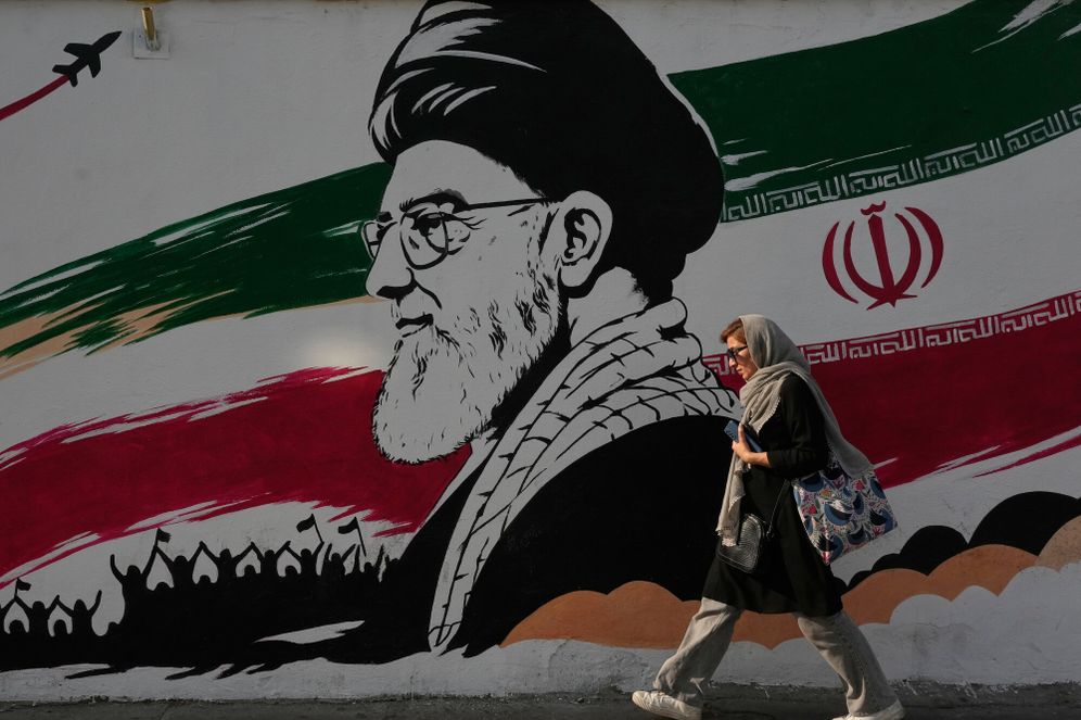 AP Photo/Vahid Salemi A woman walks past a mural depicting a portrait of the late Iranian Supreme Leader Ayatollah Ali Khamenei, who was killed in the U.S. and Israel strike on Feb. 28, at Azadi (Freedom) street in Tehran, Iran, Wednesday, July 29, 2026.