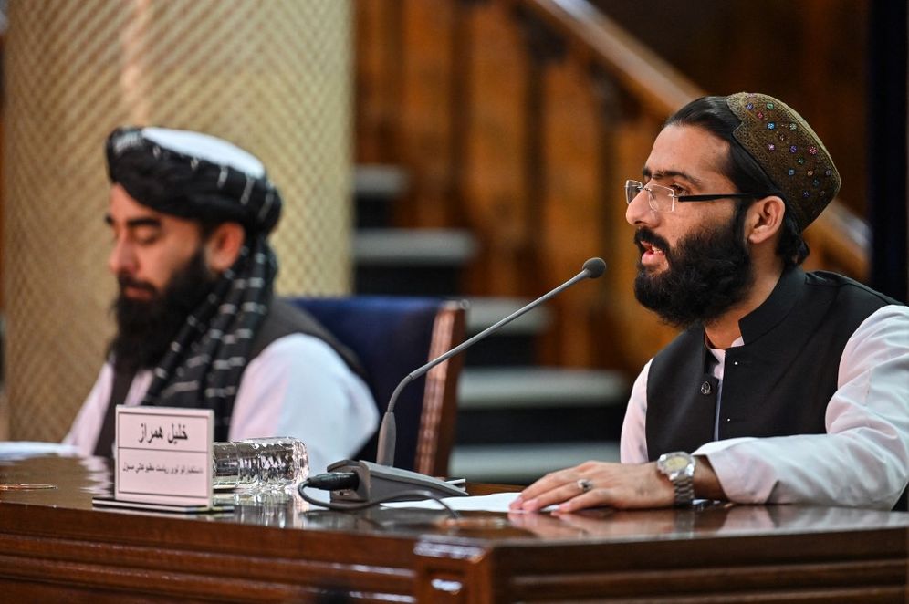 Hector RETAMAL / AFP Intelligence Service spokesman Khalil Hamraz (R), and Taliban spokesman Zabiullah Mujahid participate in a press conference at the government media and information center in Kabul, on November 10, 2021.