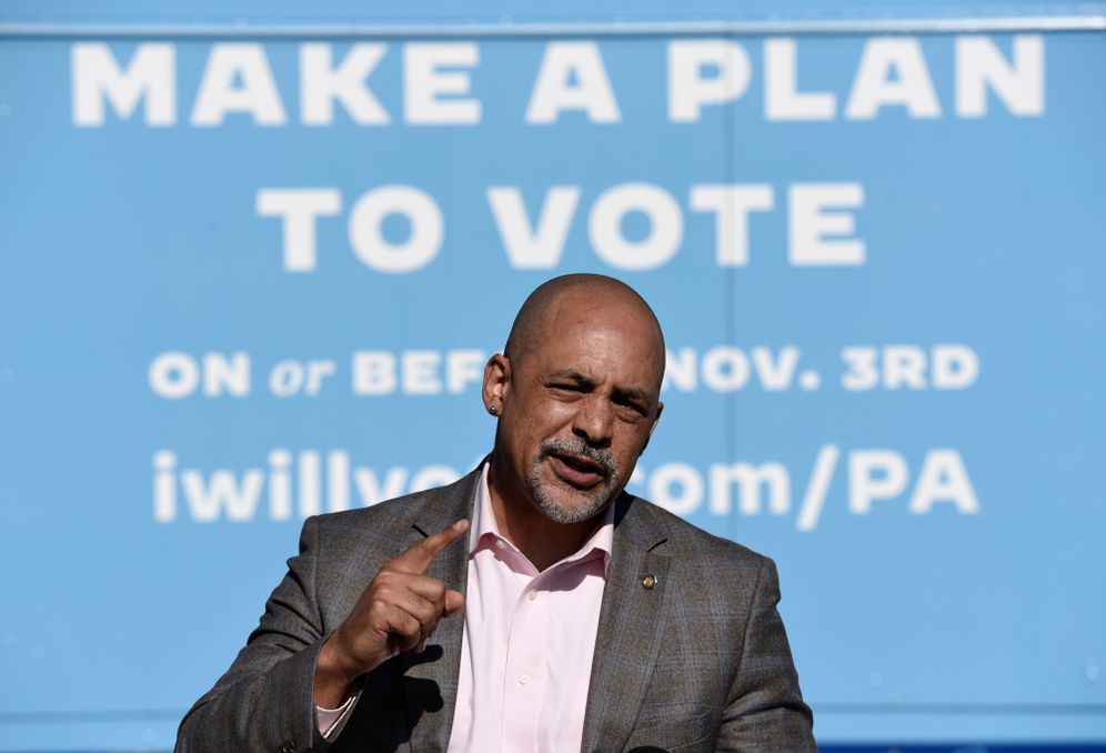 AP Photo/Michael Perez) State Rep. Chris Rabb talks to reporters during a press conference at an early voting satellite location at the Anne B. Day elementary school, Thursday, Oct. 15, 2020, in Philadelphia.