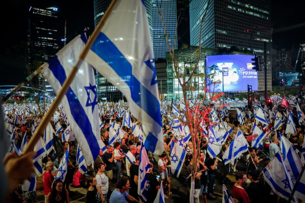 Israelis protest against the government's judicial overhaul, in Tel Aviv.