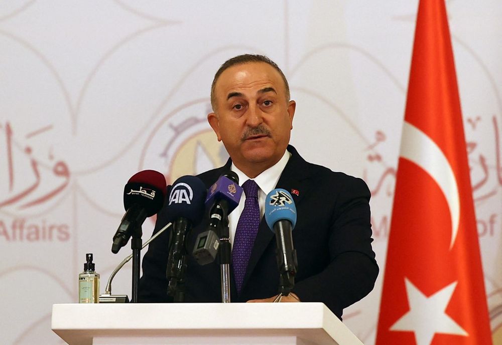 Turkish Foreign Minister Mevlut Cavusoglu attends a joint press conference following a tripartite meeting with his Russian and Qatari counterparts, on March 11, 2021, in Doha.