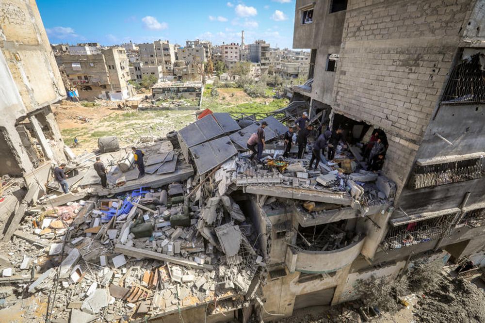 Palestinians inspect their homes after an Israeli airstrike in the Bureij camp in the Gaza Strip