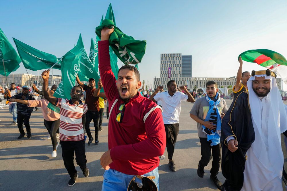Fans of Saudi Arabia celebrate their team's victory over Argentina in a World Cup group C soccer match in Lusail, Qatar.