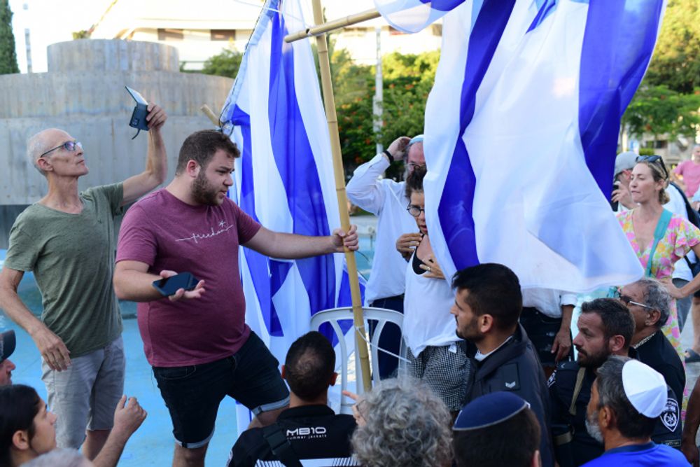 The orthodox Jewish group of Rosh Yehudi sets up a gender divider, amongst protests, during a public prayer on Dizengoff Square for Yom Kippur.