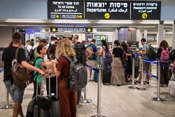 Travelers in line for check-in at the Ben Gurion International Airport, Israel, on July 7, 2022.