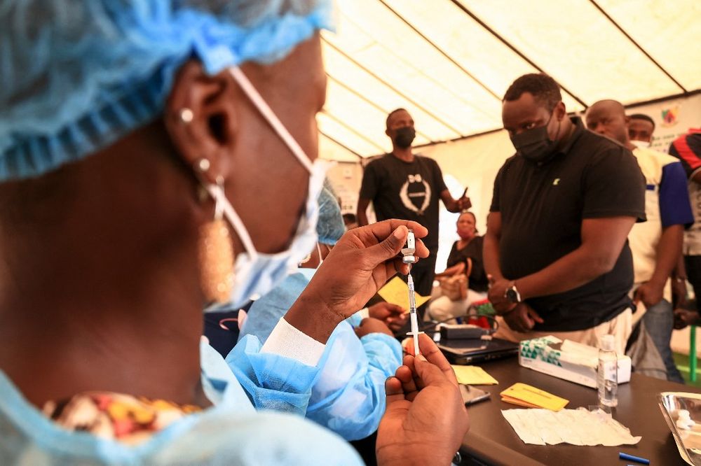 A nurse prepares a Covid-19 vaccine to a person at the Palais des Sports vaccination centre in Yaounde, Cameroon on January 6, 2022.