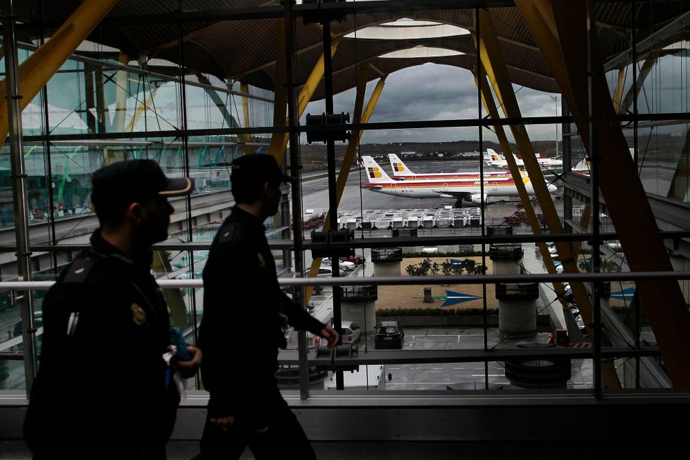 AP Photo/Andres Kudacki, File FILE - Iberia jets are seen in a parking zone as police walk through the airport during a Iberia airline workers strike at Barajas international airport in Madrid, Spain