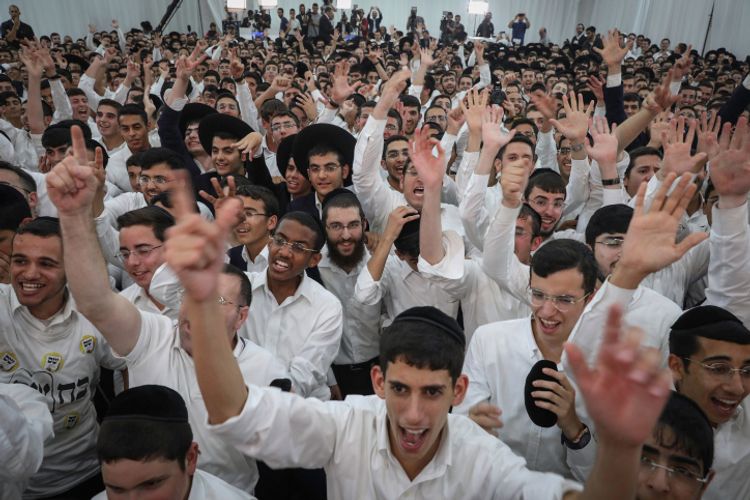 Supporters react as Shas party leader Aryeh Deri speaks at the party headquarters on election, September 17, 2019.