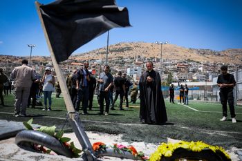 People at the scene of the deadly missile attack at a soccer field in the Druze village of Majdal Shams, in the Golan Heights