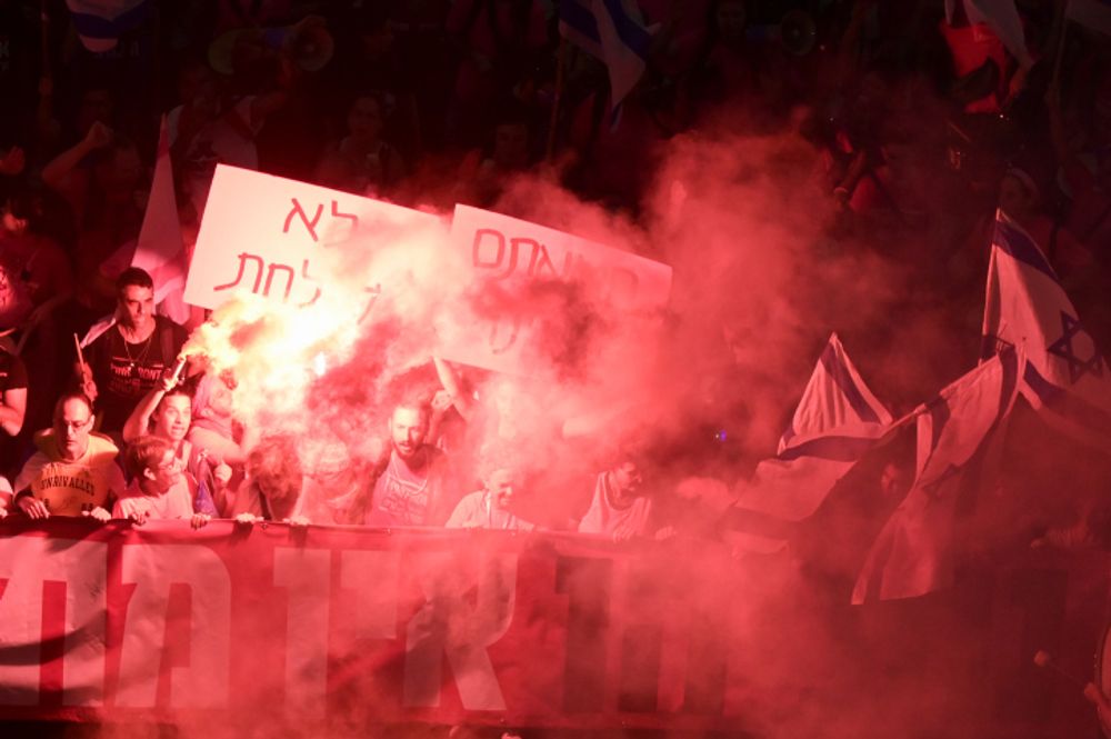 Israeli activists protest against the government's judicial overhaul, in Tel Aviv, on September 23, 2023.