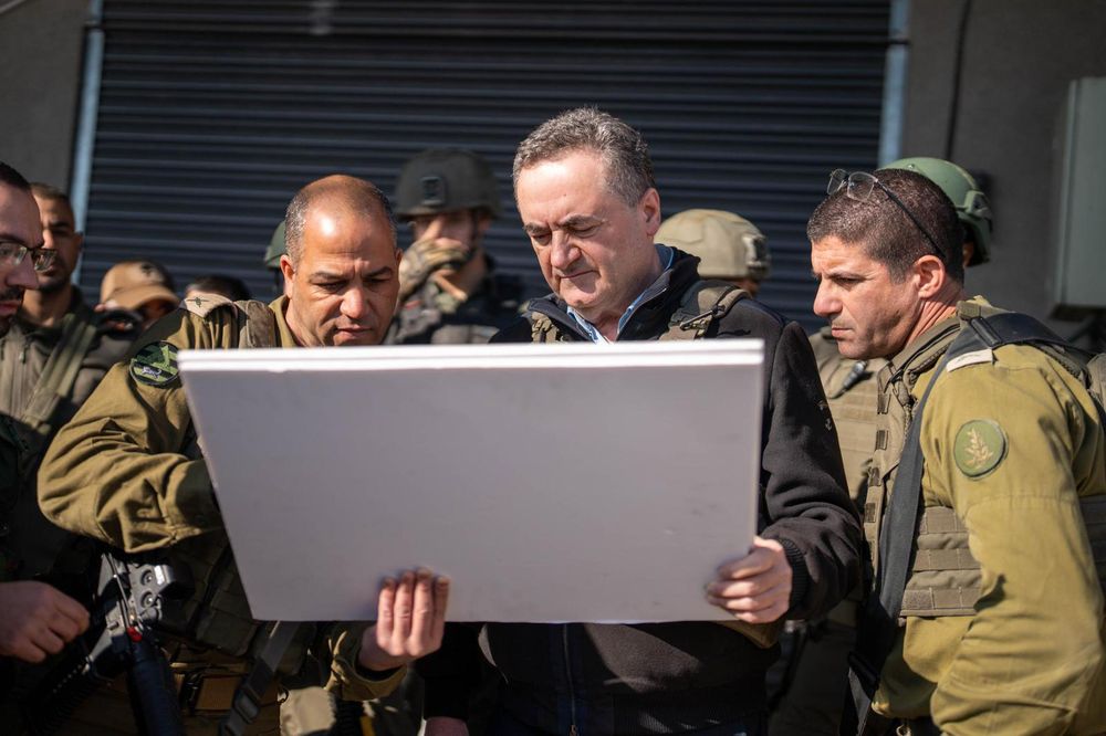 Defense Minister Israel Katz with IDF officers during a visit to the scene of a terrorist shooting attack in the West Bank