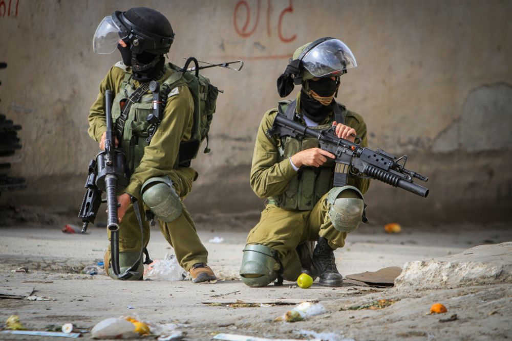 Palestinians clash with Israeli security forces near the West Bank city of Nablus.
