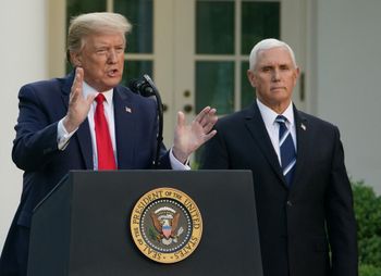 In this file photo taken on April 27, 2020 US President Donald Trump speaks as US Vice President Mike Pence look on during a news conference on Covid, in the Rose Garden of the White House in Washington, DC, US.